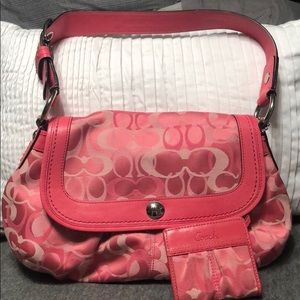 Pink coach handbag and wallet.